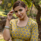 Mustard bagru handblock booti round neck cotton blouse with black piping