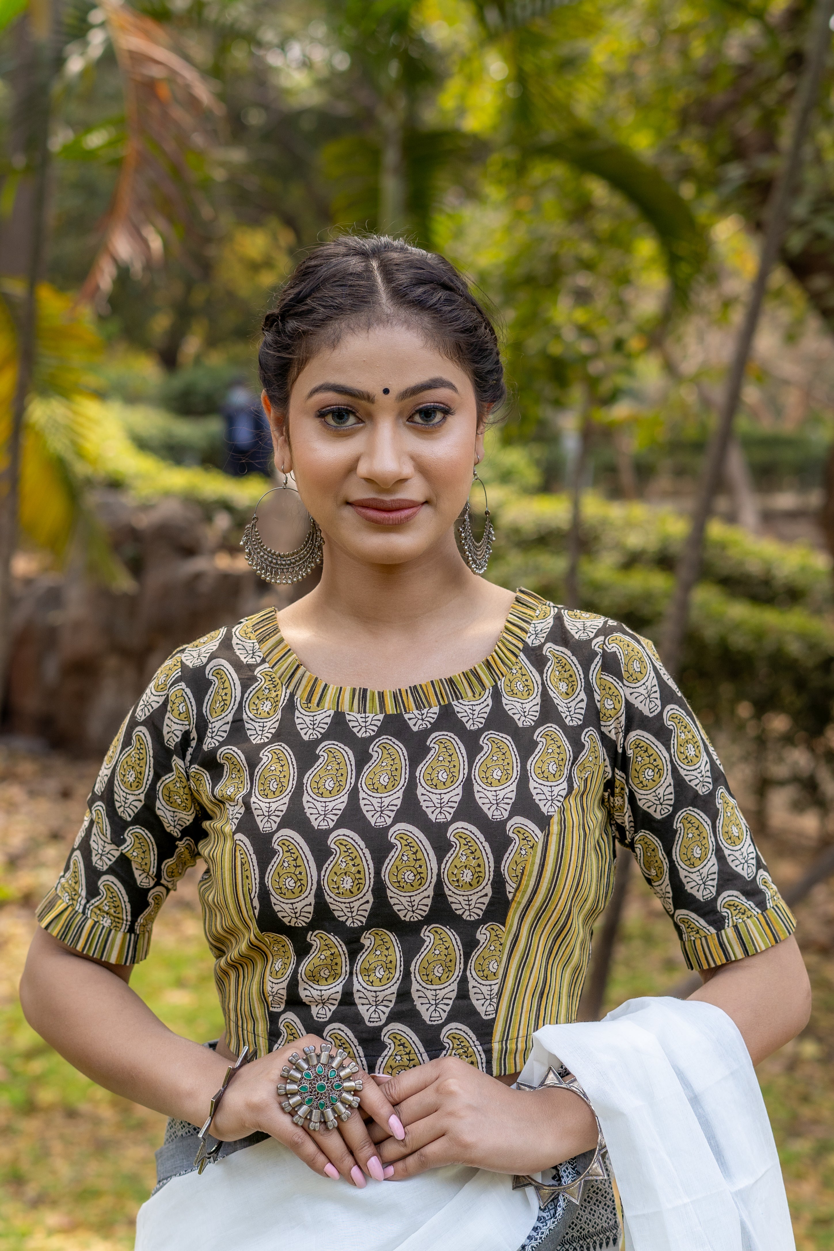 Olive and black handblock paisley print round neck cotton blouse with frills on neck and sleeves