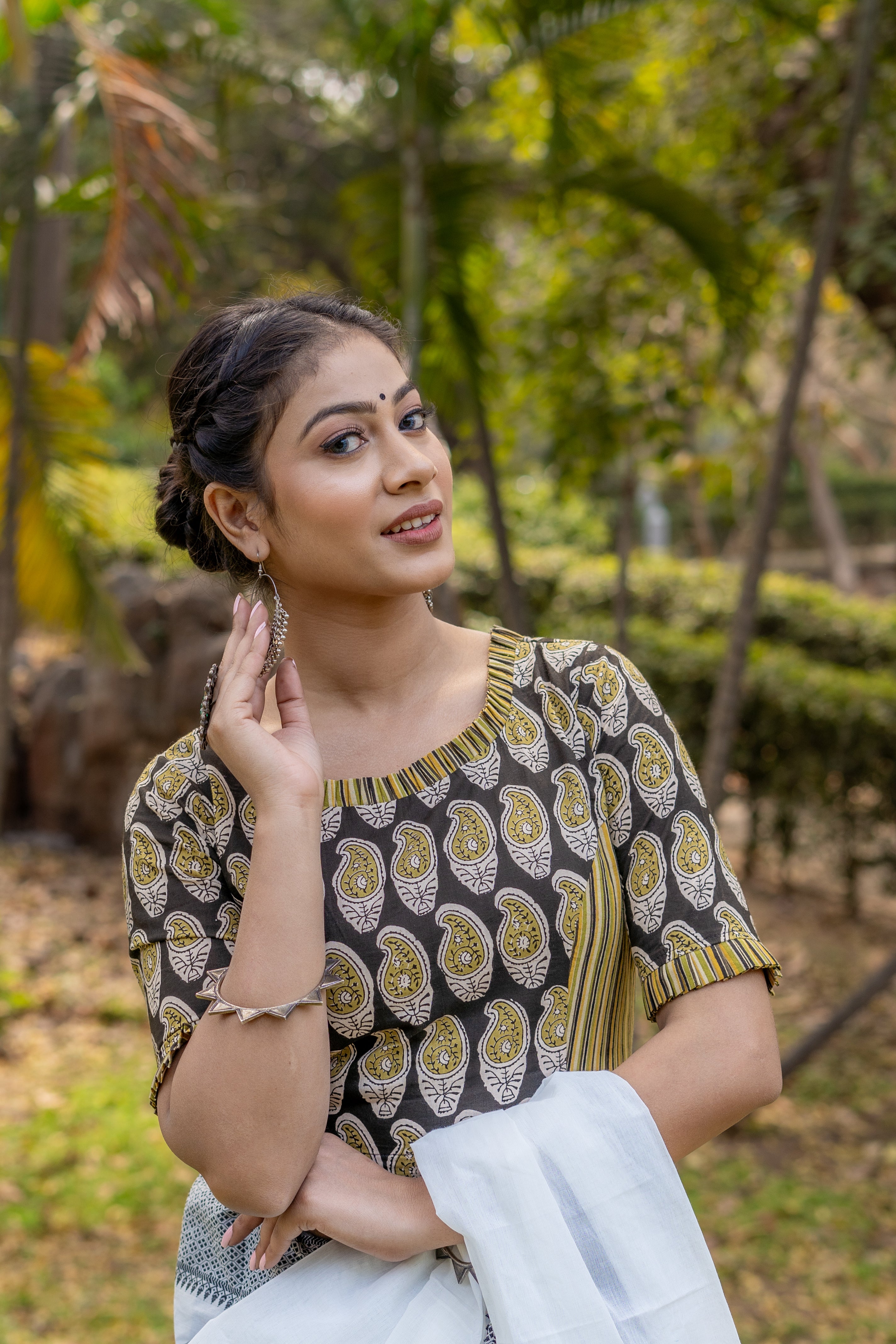 Olive and black handblock paisley print round neck cotton blouse with frills on neck and sleeves