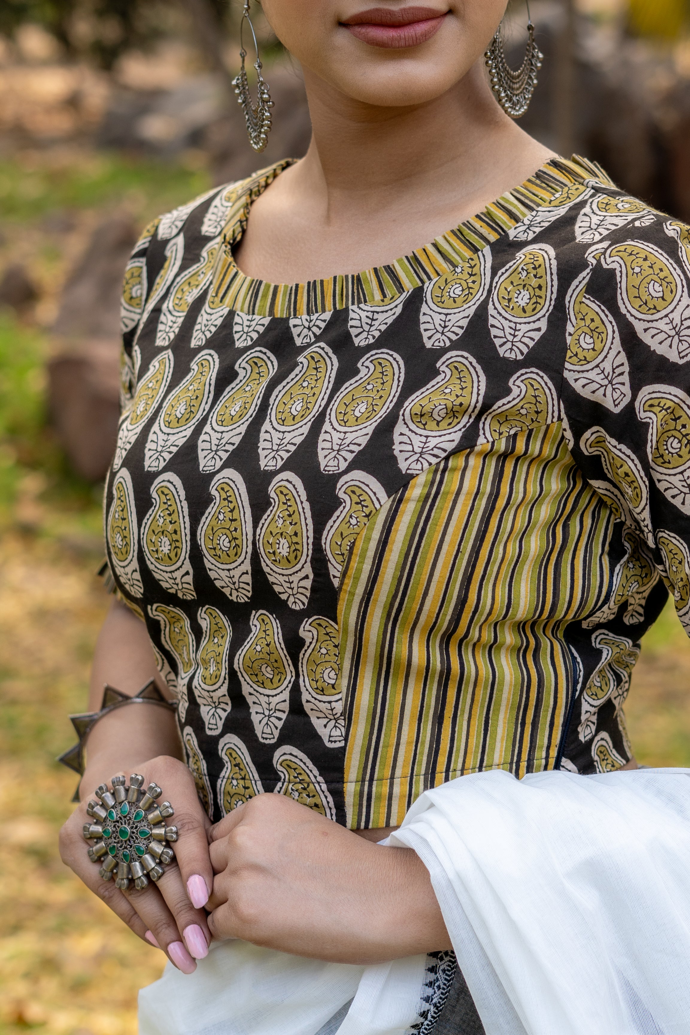 Olive and black handblock paisley print round neck cotton blouse with frills on neck and sleeves