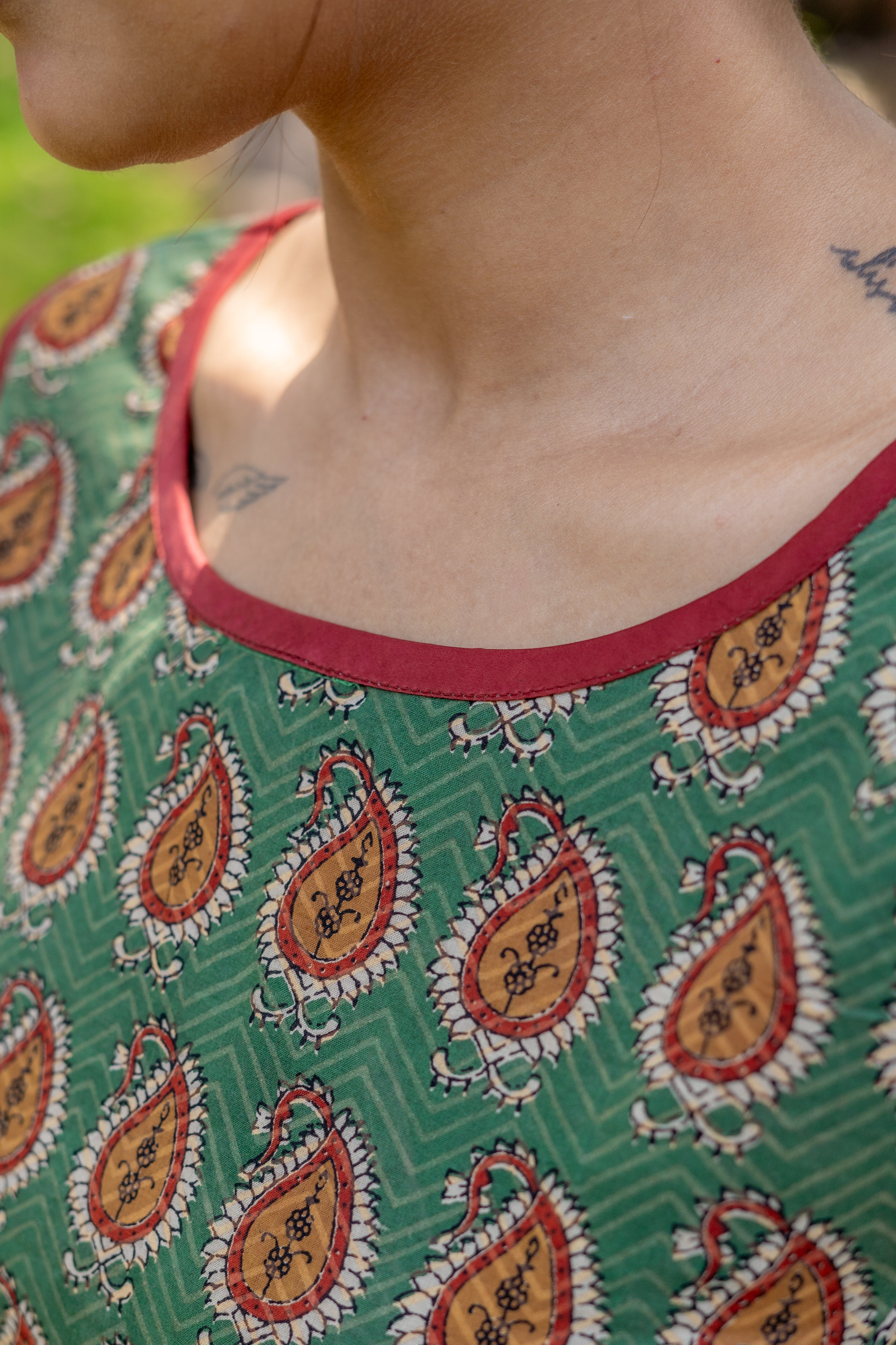 Green bagru paisley handblock print sleeveless cotton blouse with brown piping