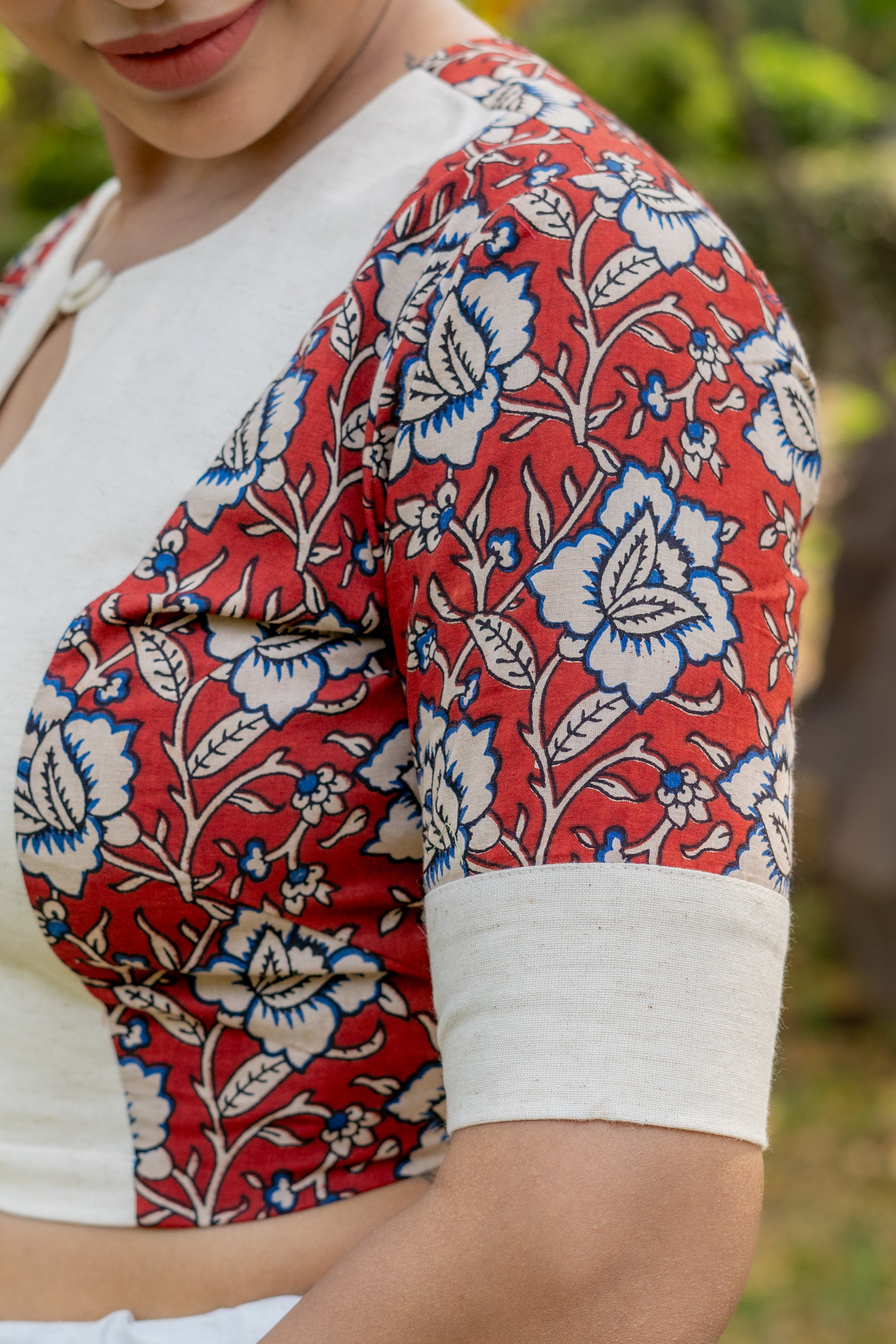 White cotton blouse with red kalamkari print on sleeves